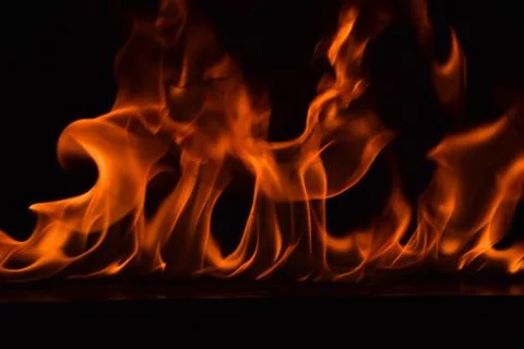 Fire flames on black background Stock Photos