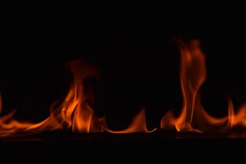 Fire flames on black background Stock Photos