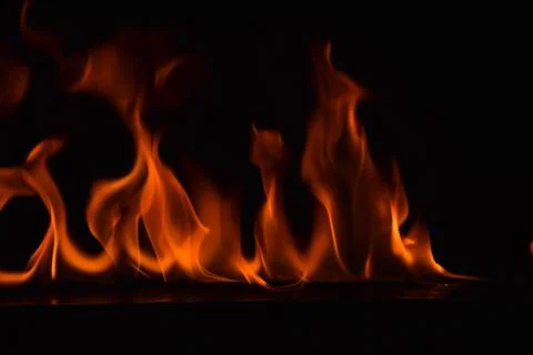 Fire flames on black background Stock Photos