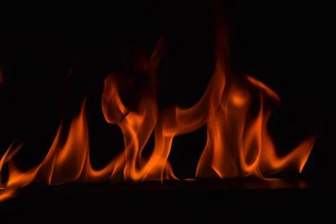 Fire flames on black background Stock Photos