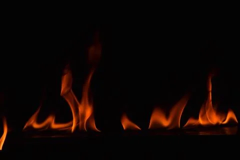 Fire flames on black background Stock Photos
