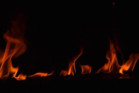 Fire flames on black background Stock Photos