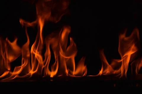 Fire flames on black background Stock Photos