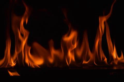 Fire flames on black background Stock Photos