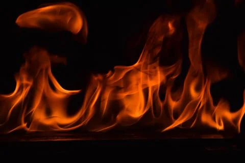 Fire flames on black background Stock Photos