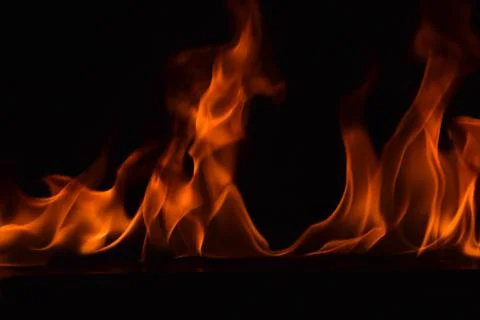 Fire flames on black background Stock Photos