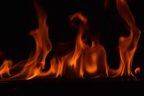 Fire flames on black background Stock Photos
