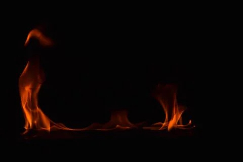 Fire flames on black background Stock Photos