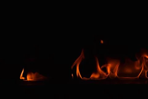Fire flames on black background Stock Photos