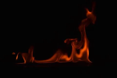 Fire flames on black background Stock Photos