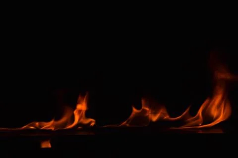 Fire flames on black background Stock Photos