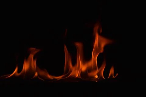 Fire flames on black background Stock Photos