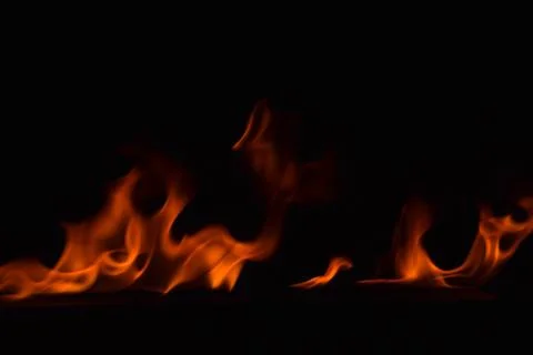 Fire flames on black background Stock Photos