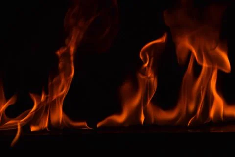 Fire flames on black background Stock Photos