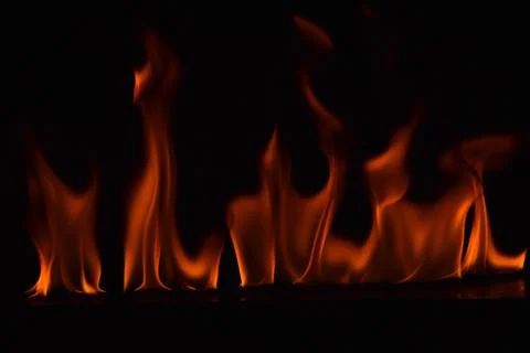 Fire flames on black background Stock Photos