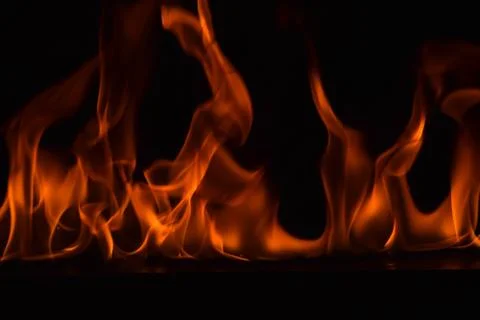 Fire flames on black background Stock Photos