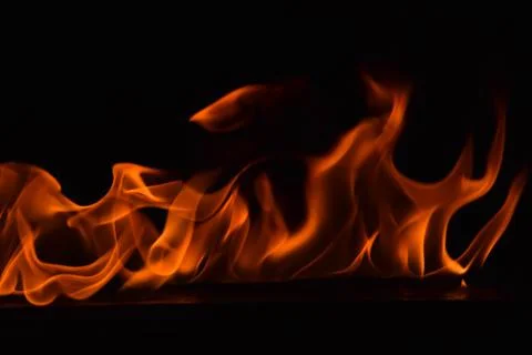 Fire flames on black background Stock Photos