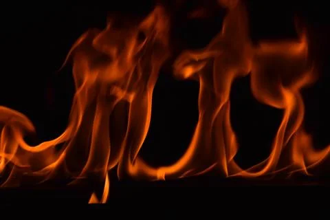 Fire flames on black background Stock Photos