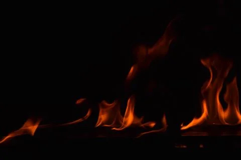 Fire flames on black background Stock Photos