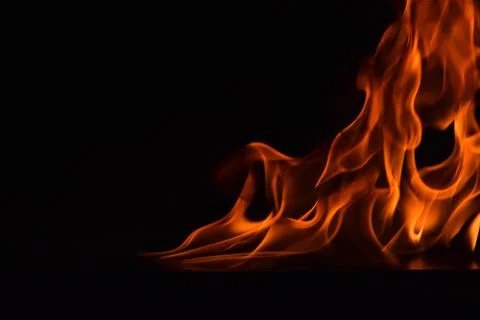 Fire flames on black background Stock Photos