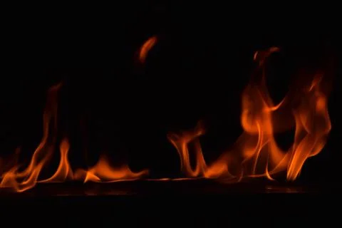Fire flames on black background Stock Photos