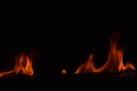 Fire flames on black background Stock Photos