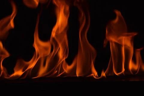 Fire flames on black background Stock Photos