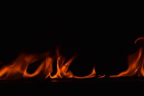 Fire flames on black background Stock Photos
