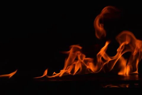Fire flames on black background Stock Photos