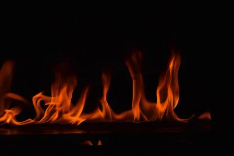 Fire flames on black background Stock Photos