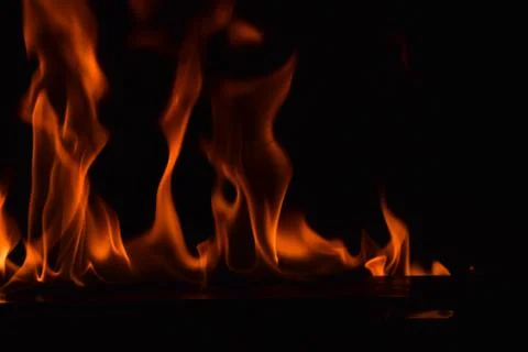 Fire flames on black background Stock Photos
