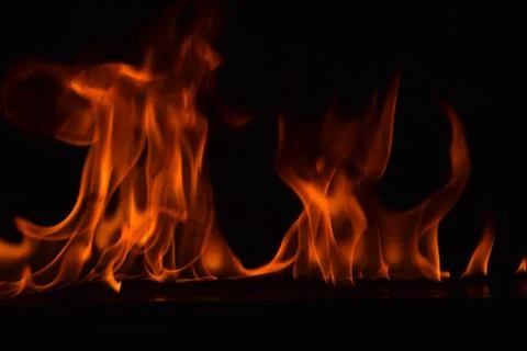 Fire flames on black background Stock Photos