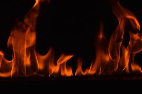 Fire flames on black background Stock Photos