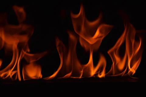 Fire flames on black background Stock Photos
