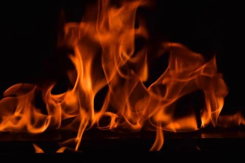 Fire flames on black background Stock Photos