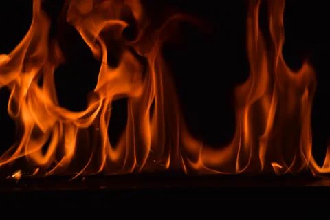 Fire flames on black background Stock Photos