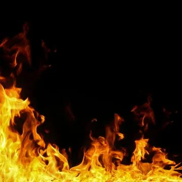 Fire flames on black background. Stock Photos