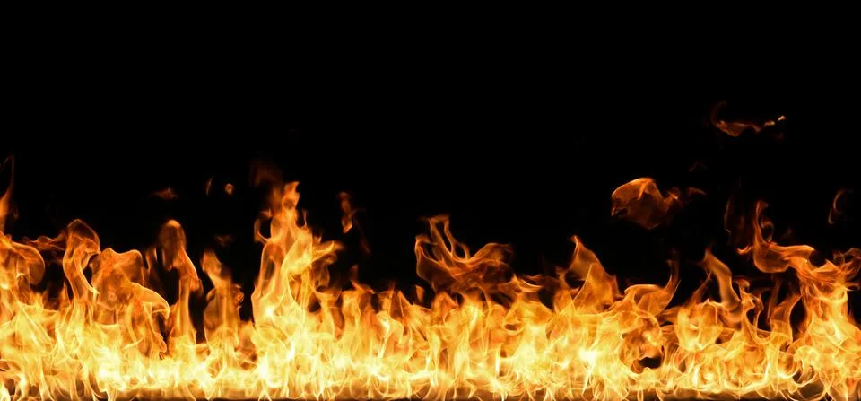Fire flames on black background. Stock Photos