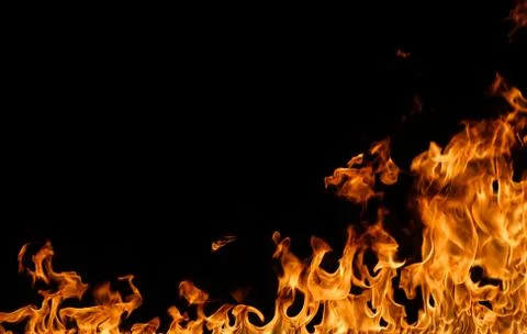 Fire flames on black background. Stock Photos