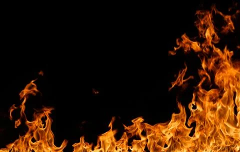 Fire flames on black background. Stock Photos