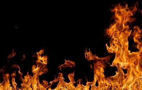 Fire flames on black background. Stock Photos