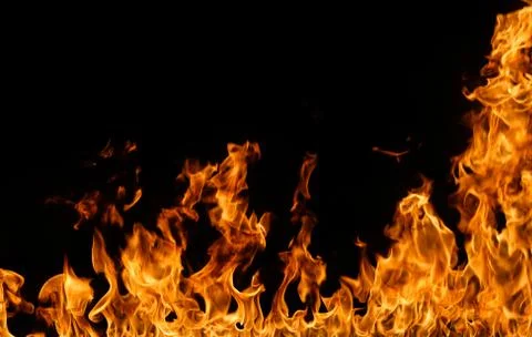 Fire flames on black background. Stock Photos
