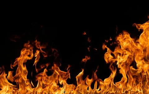 Fire flames on black background. Stock Photos