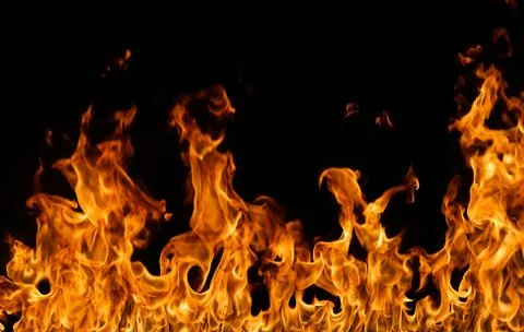 Fire flames on black background. Stock Photos