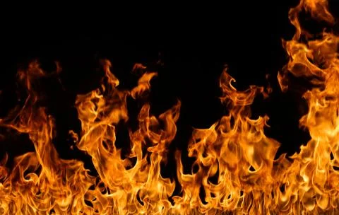 Fire flames on black background. Stock Photos