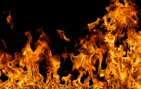 Fire flames on black background. Stock Photos