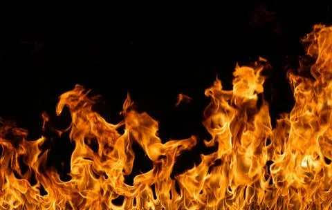 Fire flames on black background. Stock Photos