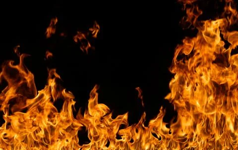 Fire flames on black background. Stock Photos