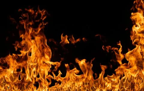 Fire flames on black background. Stock Photos