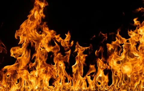 Fire flames on black background. Stock Photos